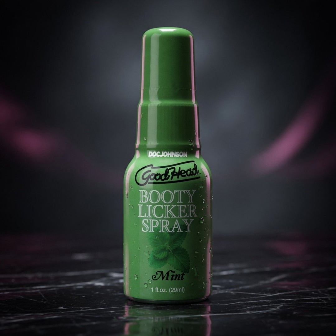 Green bottle labeled 'Booty Licker Spray' on a dark background