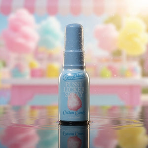 Bottle of 'GoodHead Pussy Licker Spray Cotton Candy' with a colorful, blurred background.