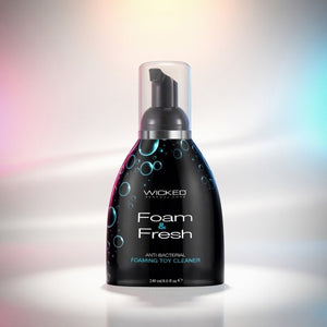 Foam & Fresh toy cleaner bottle with colorful gradient background
