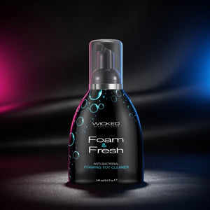 Bottle of Wicked Foam & Fresh toy cleaner on a dark background