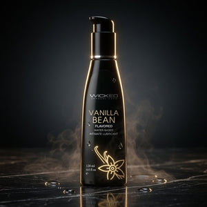 Black bottle of Wicked Vanilla Bean flavored lubricant on a dark background