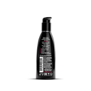 Black bottle with pump and label on a white background