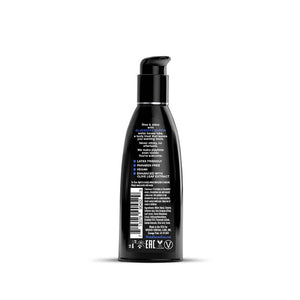 Black bottle with pump and label on a white background