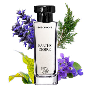 Perfume bottle labeled 'Eye of Love Earth's Desire' surrounded by flowers and leaves on a white background