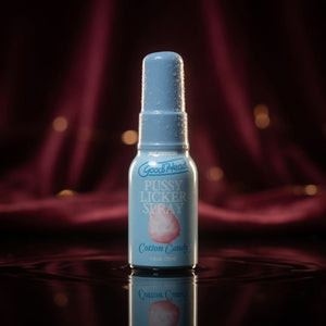Bottle of 'Pussy Licker Spray' on a dark background