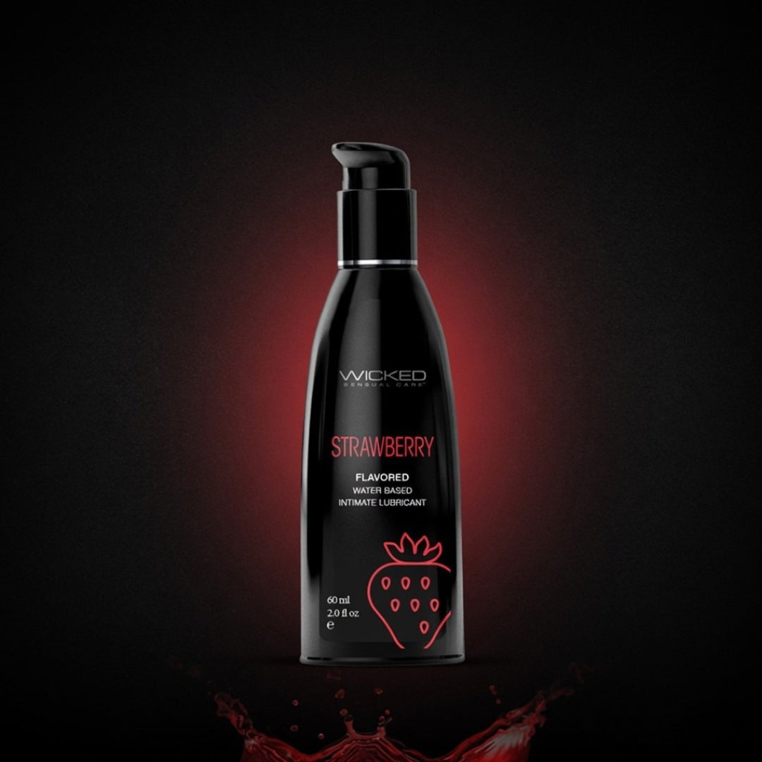 Black bottle of Wicked Strawberry flavored product on a Dark background