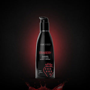 Black bottle of Wicked Strawberry flavored product on a Dark background