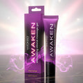 Wicked Awaken product packaging on a reflective surface with a purple glow.