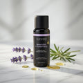 Bottle of Wicked Sensual Massage Oil with lavender and rosemary on a light background