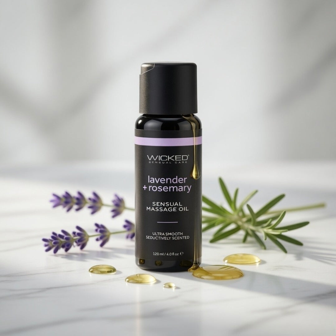Bottle of Wicked Sensual Massage Oil with lavender and rosemary on a light background