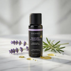 Bottle of Wicked Sensual Massage Oil with lavender and rosemary on a light background
