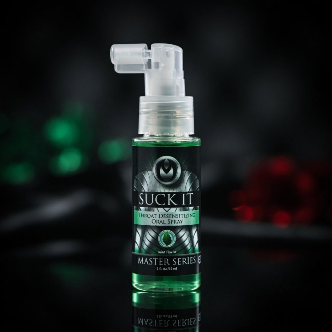Green spray bottle labeled 'Suck It' on a dark background