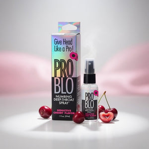 PRO BLO numbing deep-throat spray with packaging and cherries on a light background