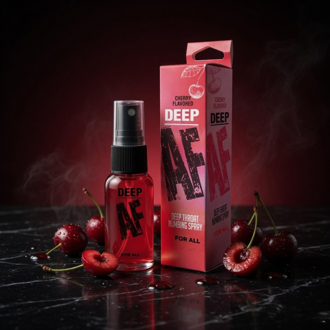 Red spray bottle and packaging with cherries on a dark surface