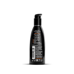 Black bottle with pump and label on a white background