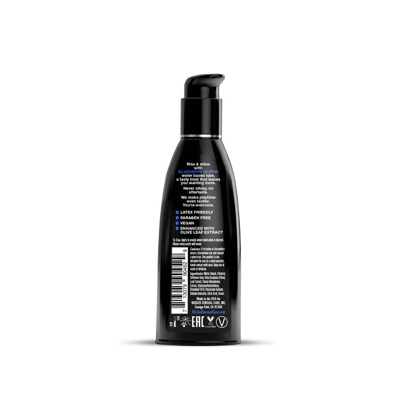 Black bottle with pump and label on a white background