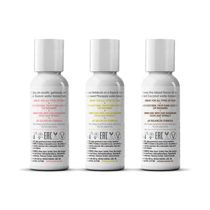 Three white bottles with labels on a white background