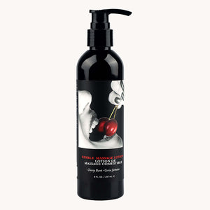 Black massage lotion bottle with cherry design on label against a white background